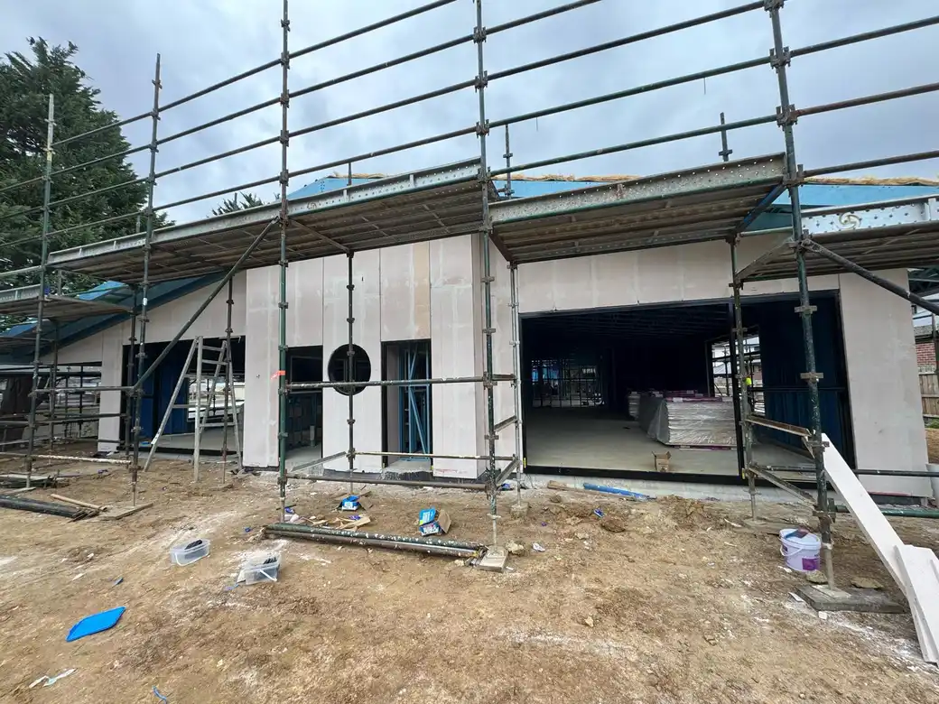 Professional cladding installation on modern building exterior